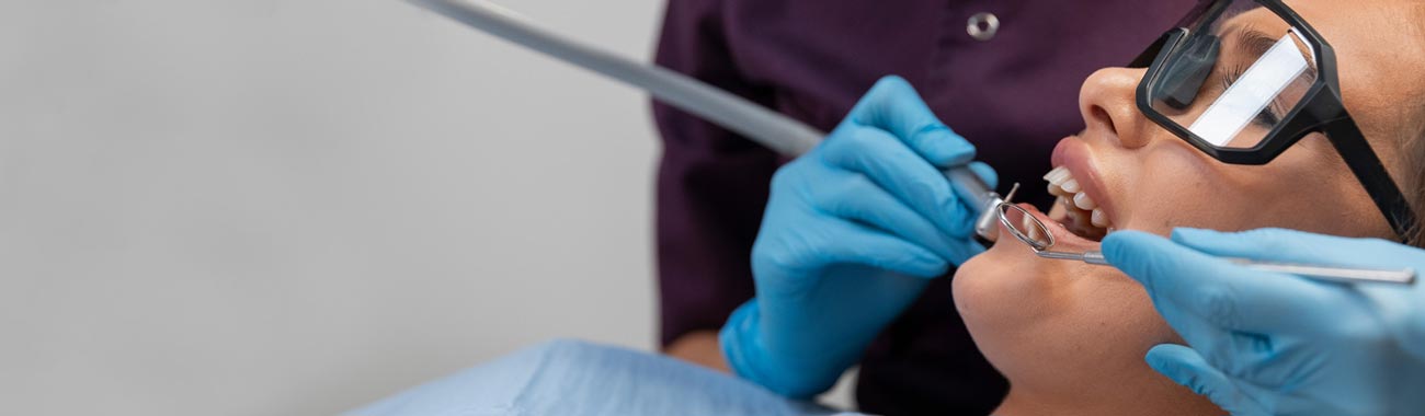 a person wearing blue gloves